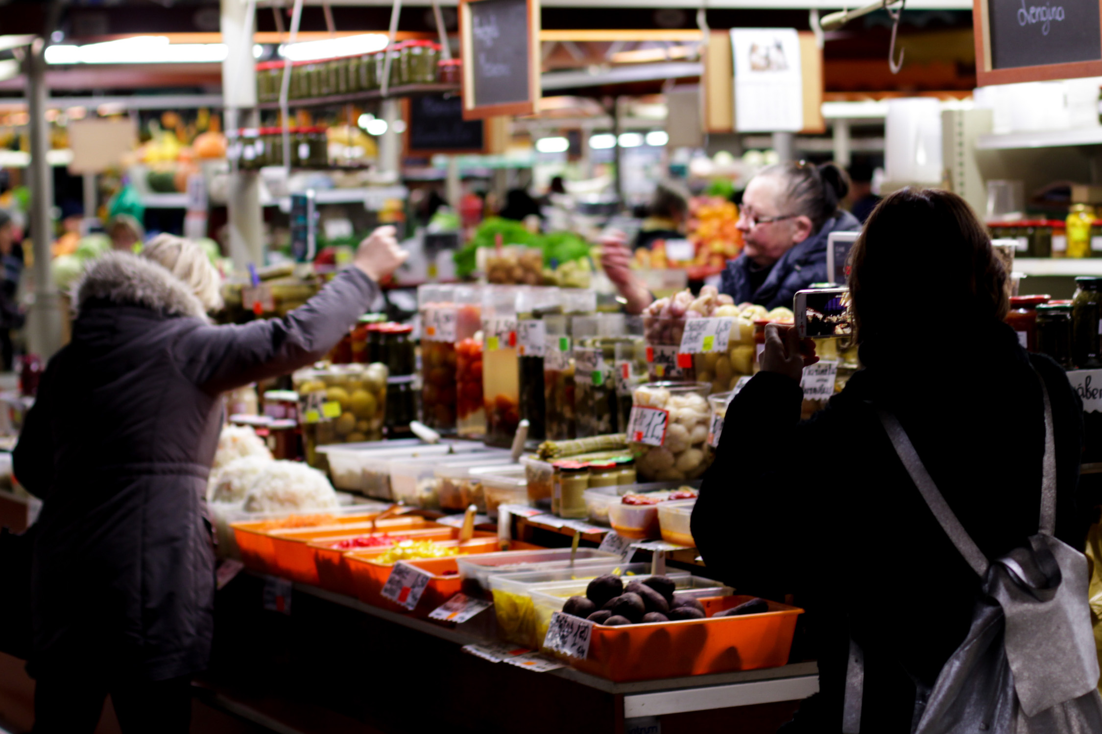 Goldie taking a picture at the central market